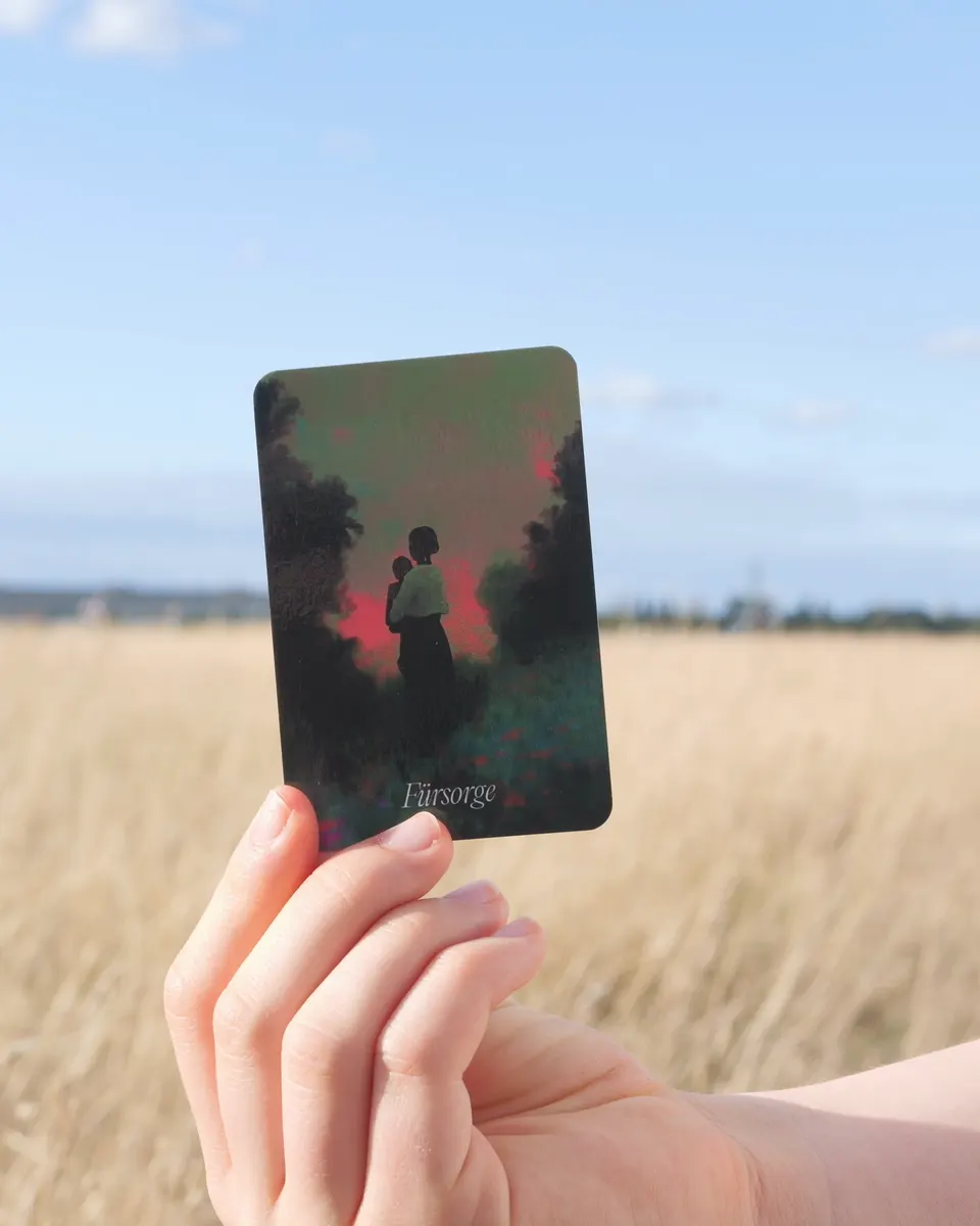 The BlickWinkel care card held by a hand at Tempelhofer Feld